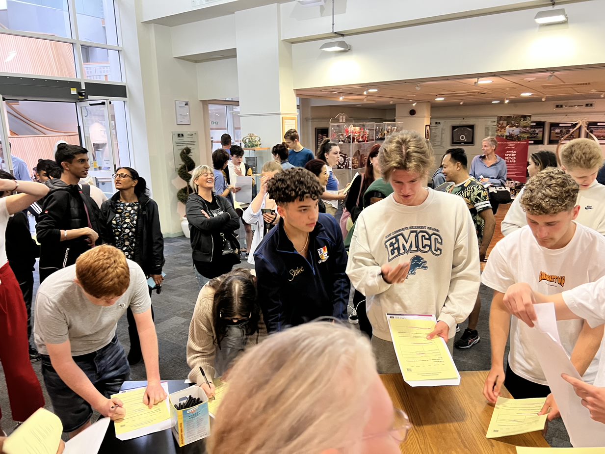 Crowd of students collecting their A Level results at Northampton School for Boys in August 2022